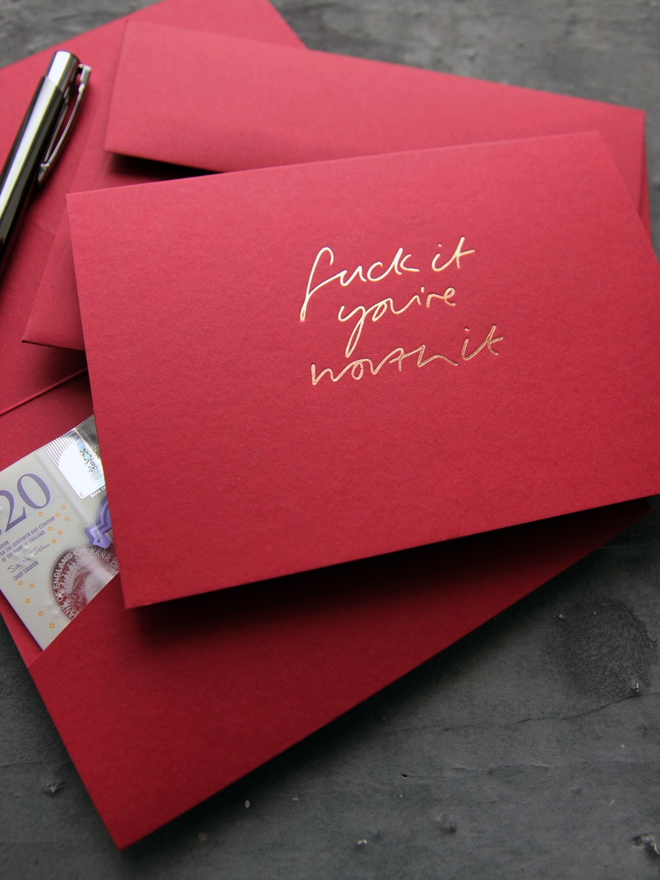 Fuck It You're Worth It cash card in scarlet with rose gold foil and matching envelope