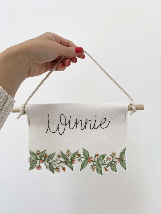 Flower Trim Personalised  Felt Banner being held