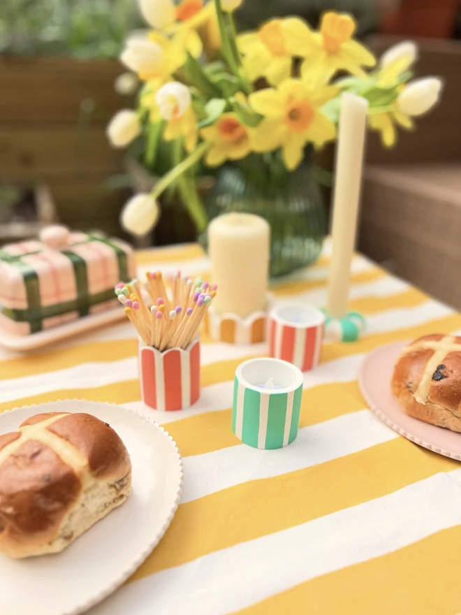 table display featuring mini stripy pot as a tea light holder