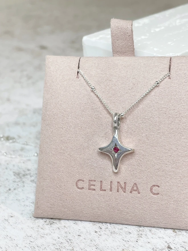 Handmade 'You're A Star' charm necklace made from 100% recycled sterling silver, set with a Ruby, the birthstone of July. A perfect gift for your friend, girlfriend or wife for their birthday or just to remind them how much you love them! Add a personalised initial and send straight to your special someone. Made by Celina C Jewellery, a small business in the UK, find on Holly and Co.