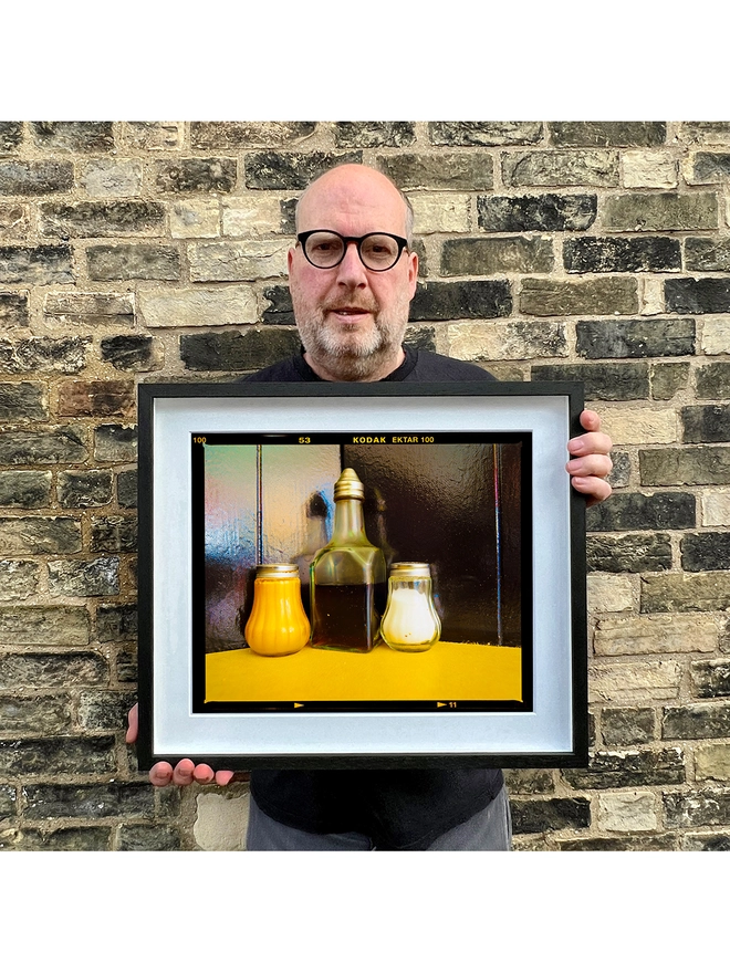 Richard Heeps holding Pepper, Vinegar and Salt small black frame