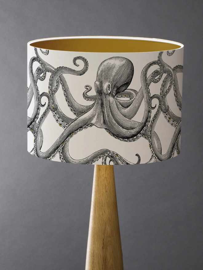 Drum Lampshade featuring Octopus with a gold inner on a wooden base 