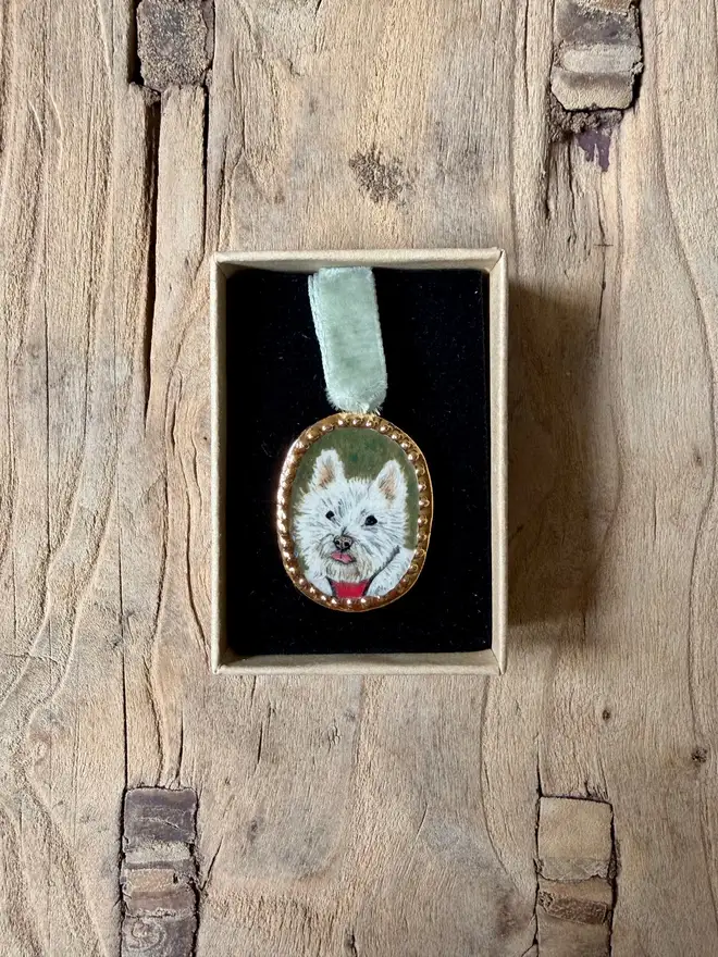 custom pet portrait pendant miniatures. a miniature painted dog portrait in a pendant frame.