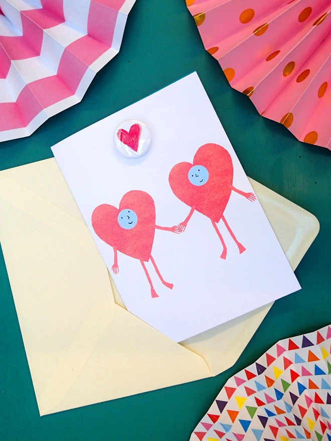anniversary card with a heart pin badge