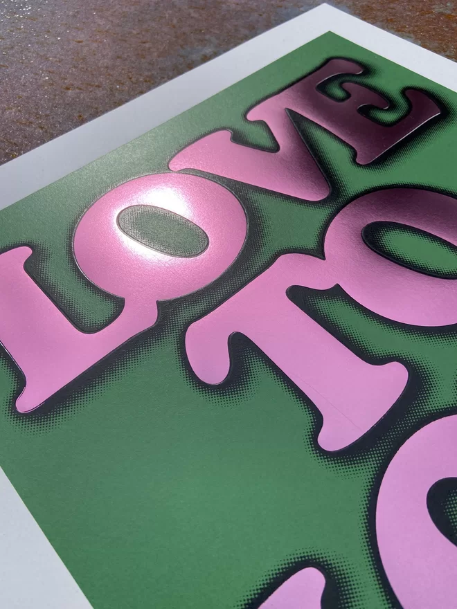 Metallic Hot Foil  "Love to Love" Screen Print in green. typography says love to love with a drop shadow the print is square 