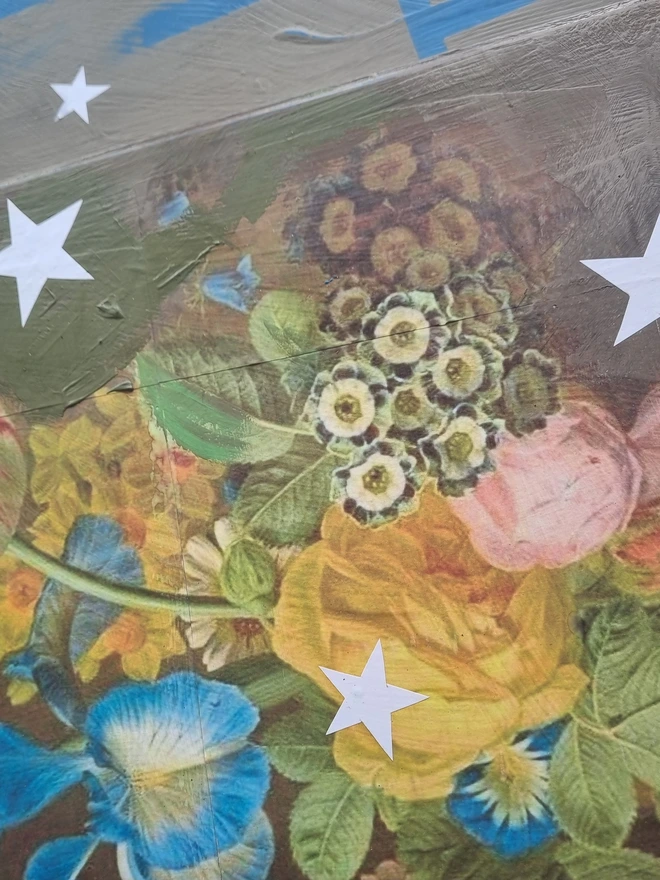 Vintage painted dressing table and chair. Painted in coffee grey and decorated using layered antique florals with yellow and blue accents and finished with hand-cut white paper stars. Text reads in blue 'think happy thoughts'. Heavily distressed finish.