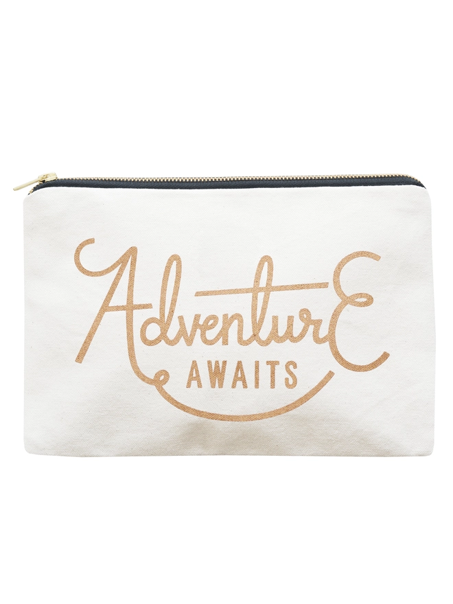 a natural canvas zip pouch with the words adventure awaits