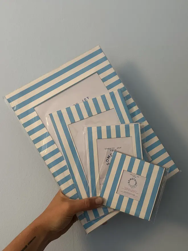 Thin Striped Screen Printed A6 / A5 / A4 Photo Mount. blue mounts in various sizes pictured against grey background.