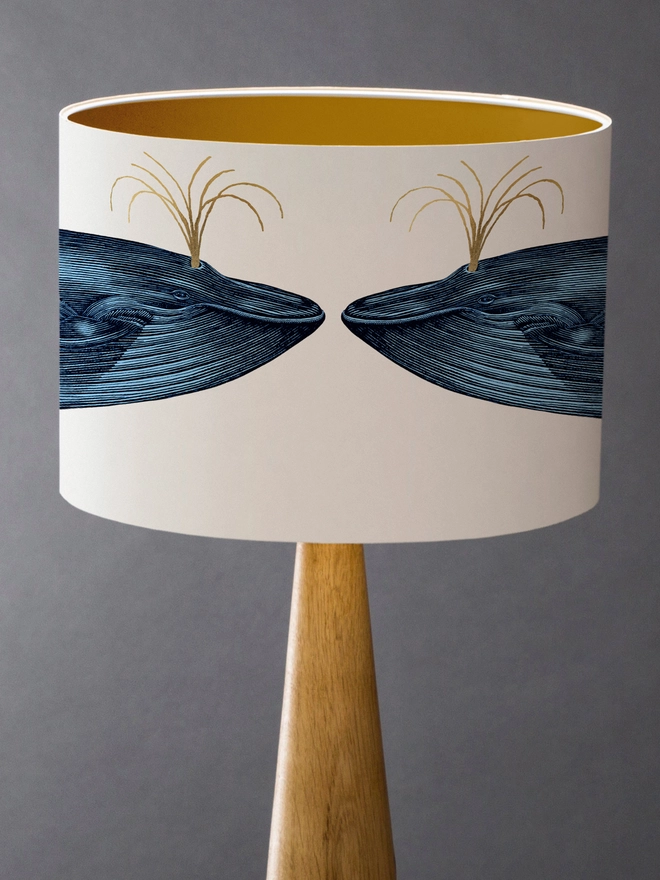 Handmade blue whale lampshade with gold details featuring vintage inspired ocean artwork