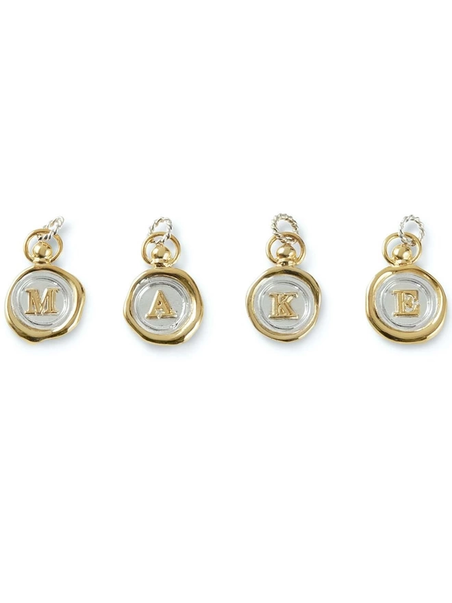 gold plate personalised charms, spelling MAKE