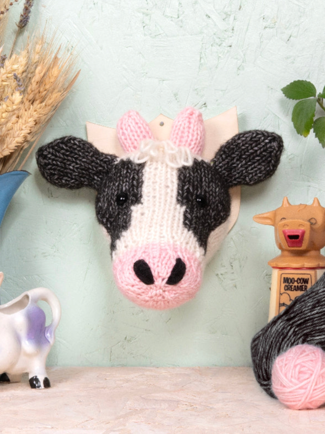 Dairy Cow Head Knit Kit. A mini dairy cow head, completed and mounted.