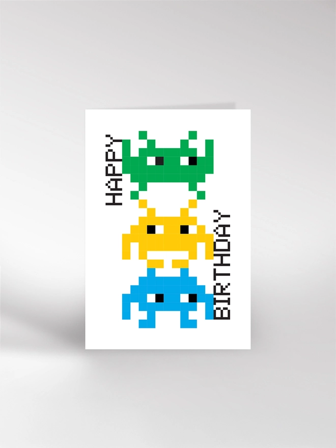 Happy Birthday card featuring a stack of arcade invaders