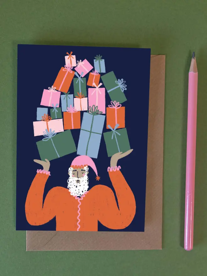 Festive Santa with Gifts Greetings Card, against a green background. 