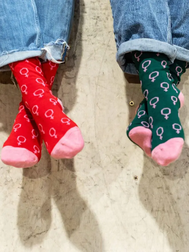 two models wearing venus socks. One model is wearing red the other is wearing green