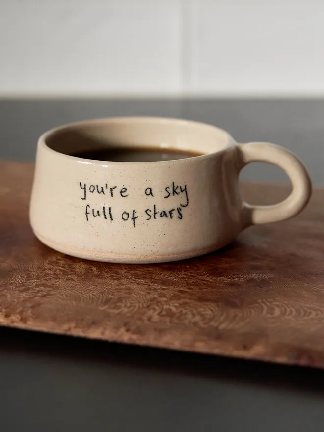 Cream ceramic mug with the words 'Youre a Sky Full of Stars' written on it 