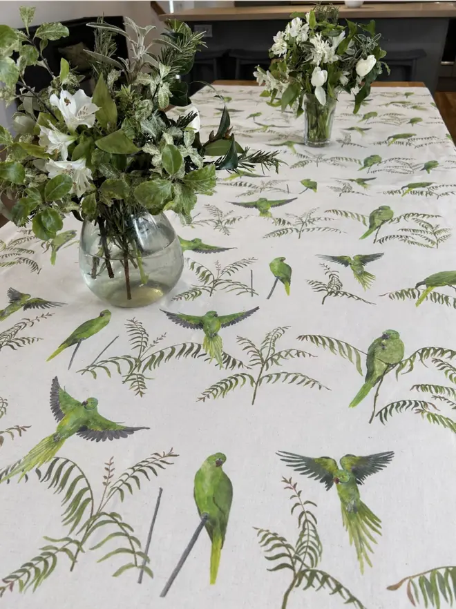 Linen tablecloth featuring hand painted Pink Ringed Parakeets