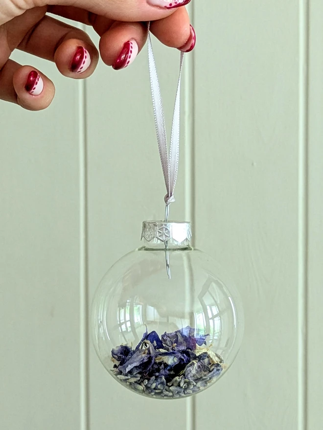 blue flower petals in glass bauble