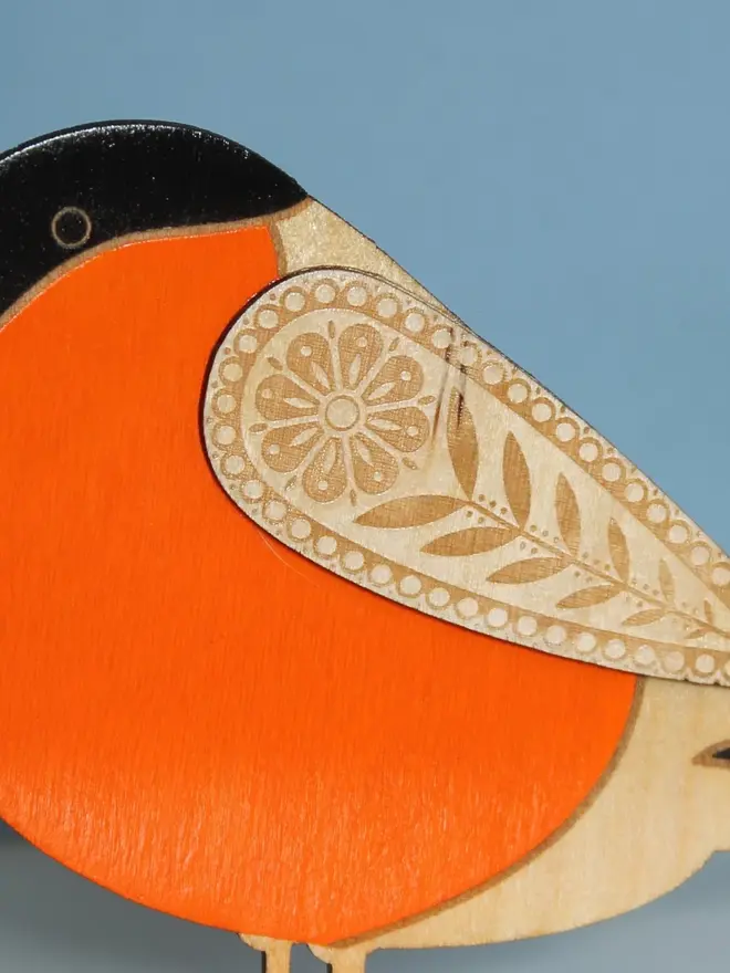 Standing Wooden BullFinch,Standing Wooden BullFinch, orange wooden bird decoration standing on a platform. 