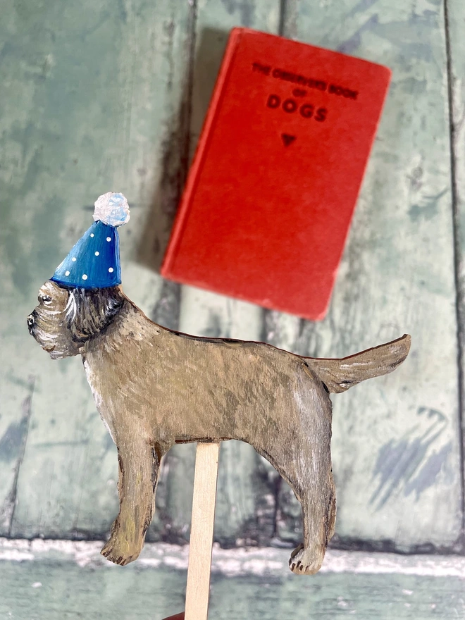 Border Terrier Hand Painted Wooden Cake Topper with a blue hat