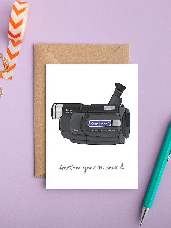 Illustrated VHS camcorder birthday card with handwritten caption ‘Another year on record’