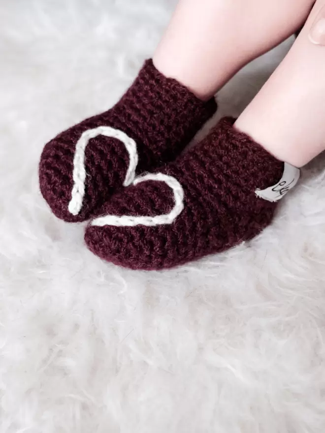 Baby booties with heart embroidery