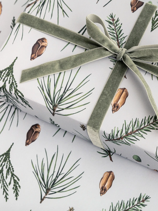 Grey based christmas wrap with festive tree botanical elements