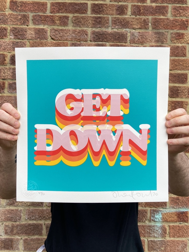 "Get Down" Hand Pulled Screen Print  square green background with rainbow letters that say get down printed on top with shading in yellow and red 
