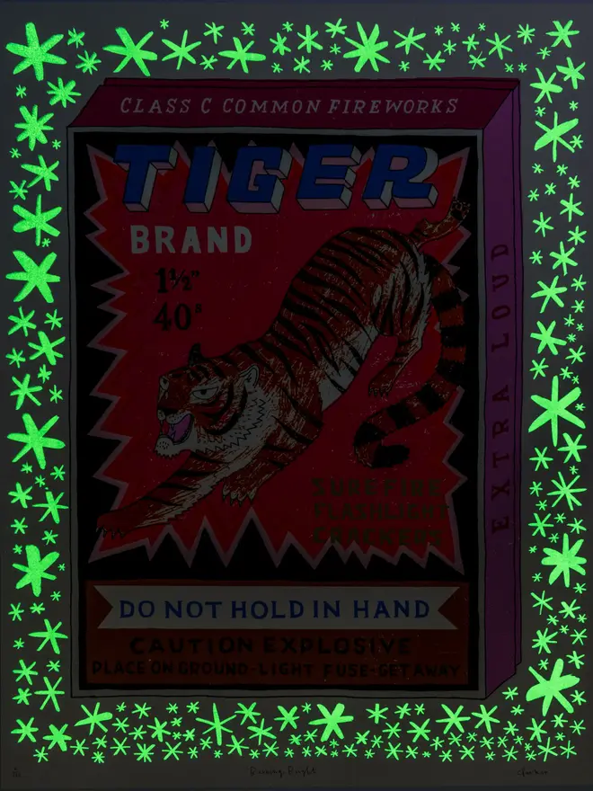 Tiger Firecracker Box Screenprint Burning Bright, a colourful firecracker box design on a white screenprint. The glow in the dark design can be seen. 
