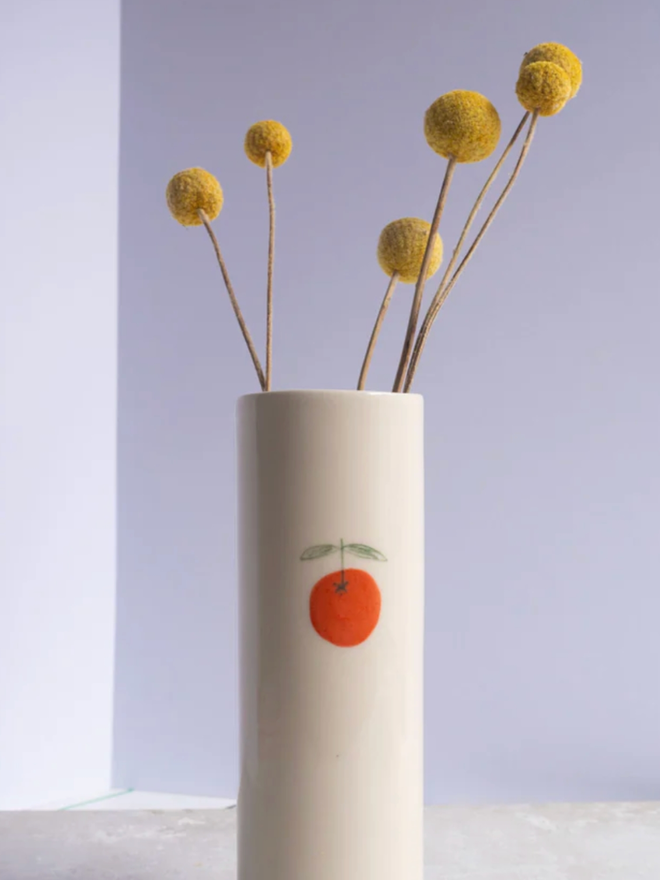 Symbol Vase. A vase with an orange design.