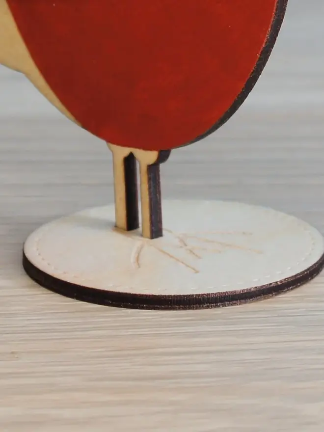 Standing Wooden Chaffinch, red wooden bird decoration standing on a platform. 