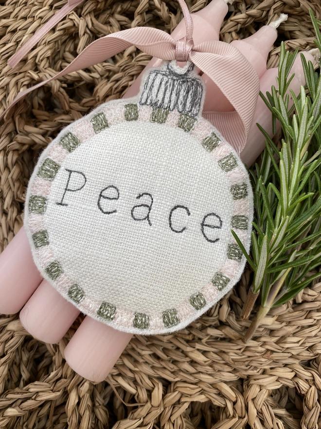 Peace Embroidered Square Edge Detail Bauble in basket