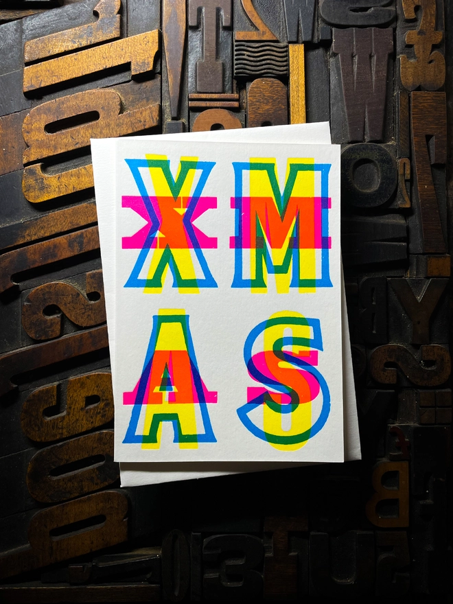 Festive Christmas typographic letterpress card with deep impression print. Very colourful and vibrant. With Pristine White envelope.