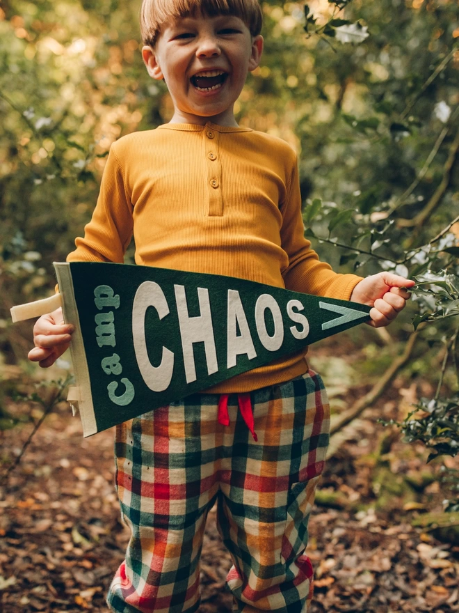 Boy holding personalised camp chaos flag