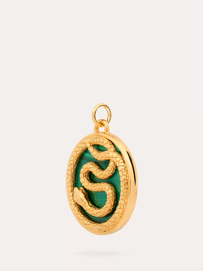 side view of Aesclepius Snake gold Medallion on malachite stone