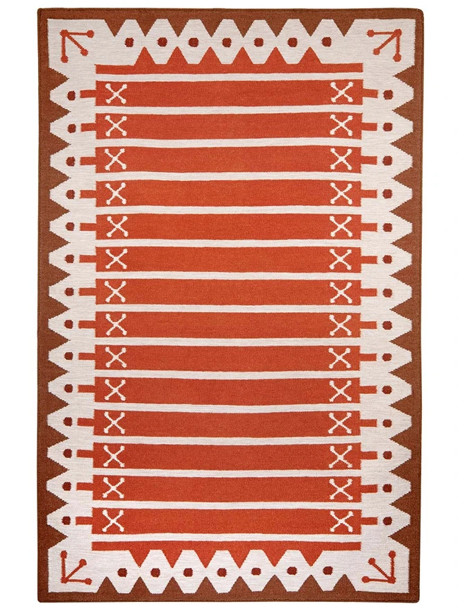 Darjeeling Flatweave Rug, a colourful rug on a plain surface. 
