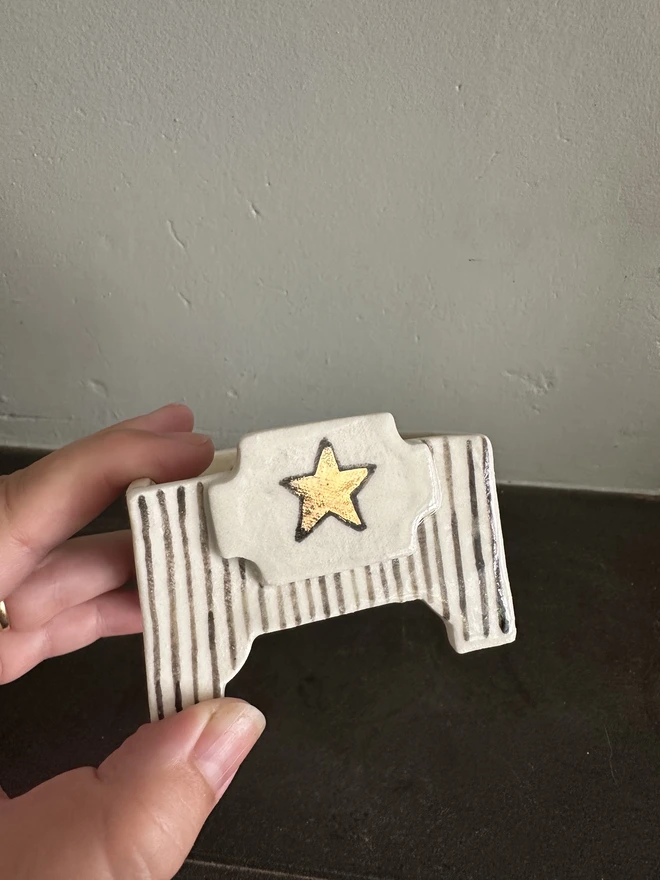 square star candle holder being held