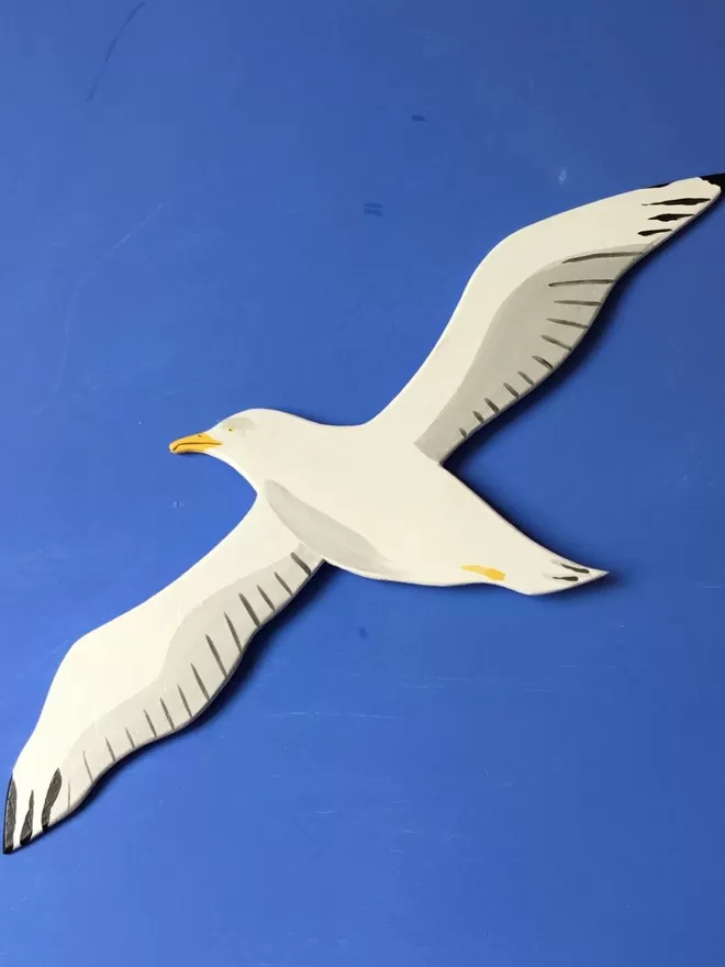 Seagull wall art on blue wall