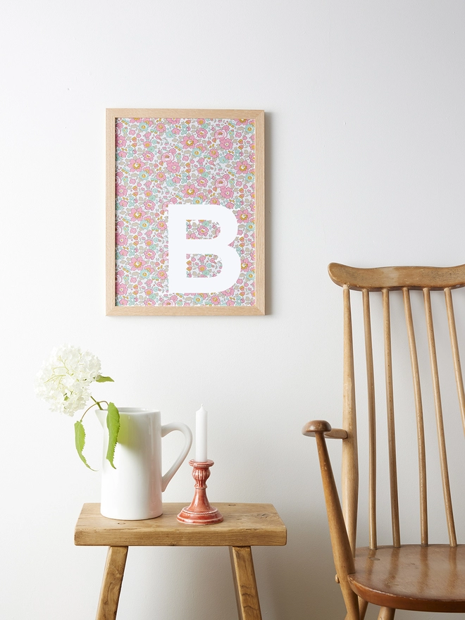 Personalised framed white initial on Liberty Betsy pink fabric