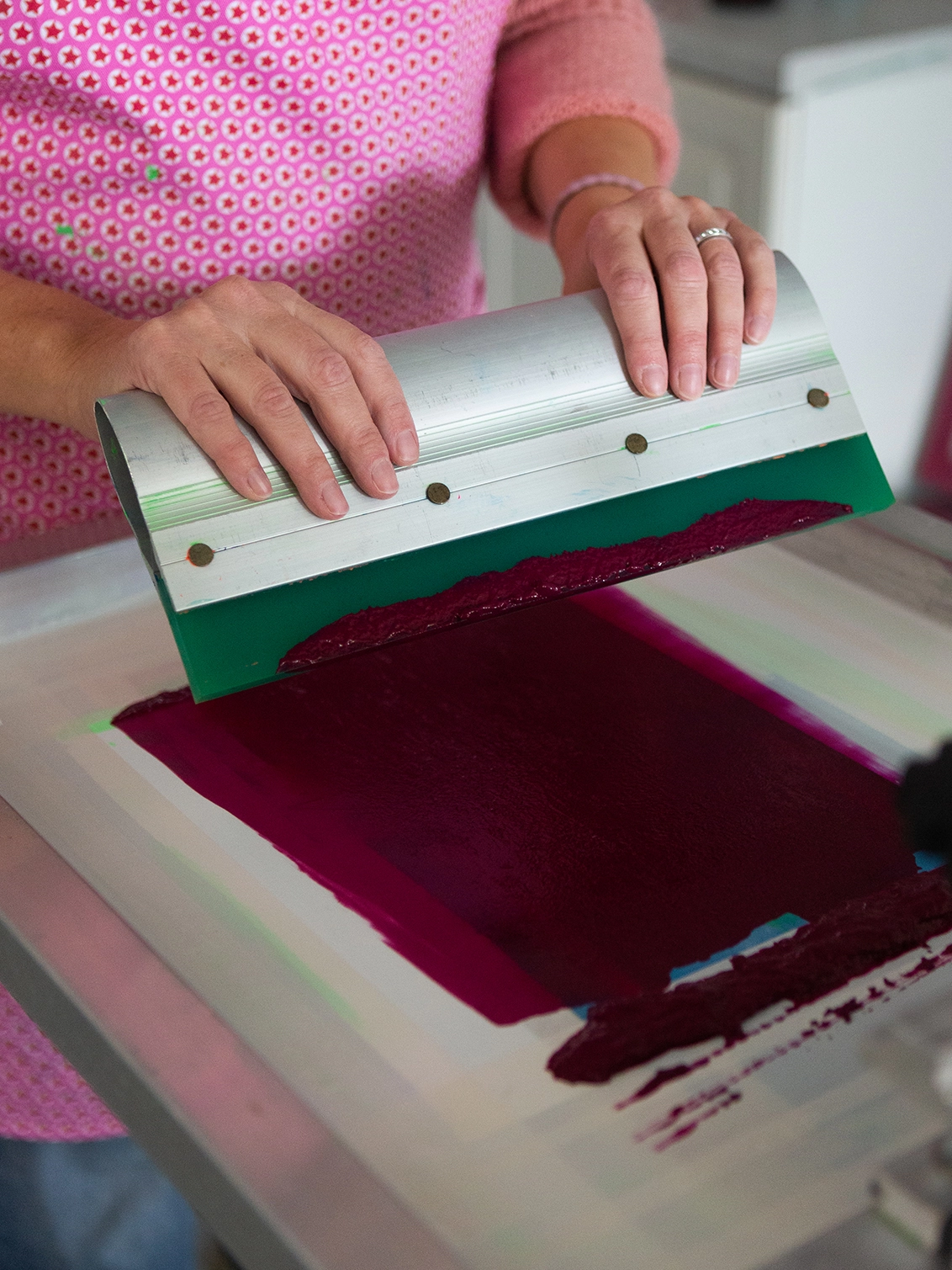 Screen printing girls drawing onto her t-shirt