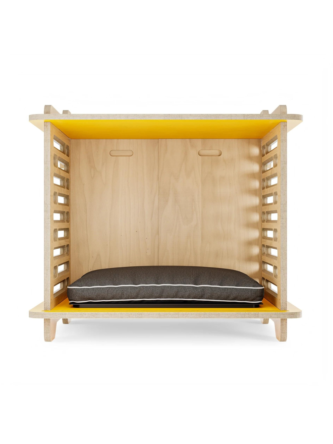 wooden dog crate with yellow top and cushion