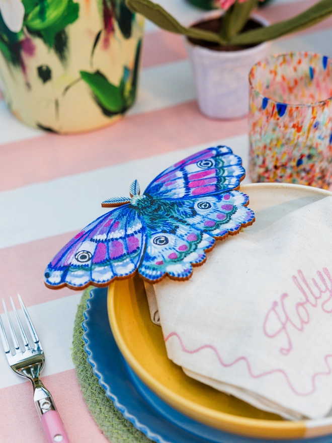 wooden emperor moth wall decoration. blue wooden moth, adding to the place setting 