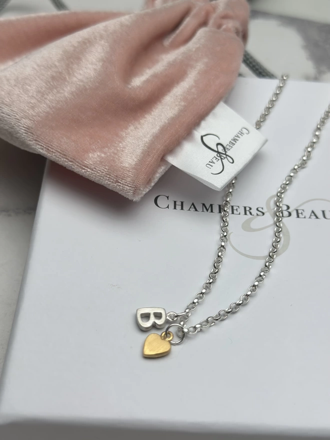sterling silver chain with sterling silver initial charm and gold mini heart