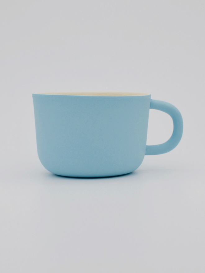 Handmade Porcelain Coffee Cup. A blue coffee cup.