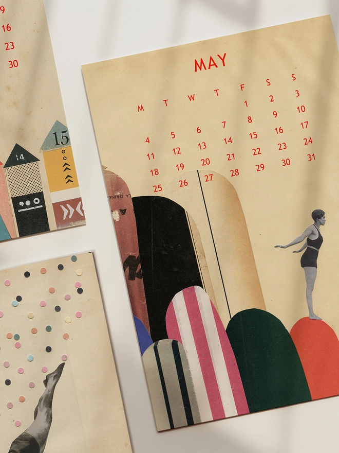 Three pages of a desk calendar sitting on a sunlit desk.