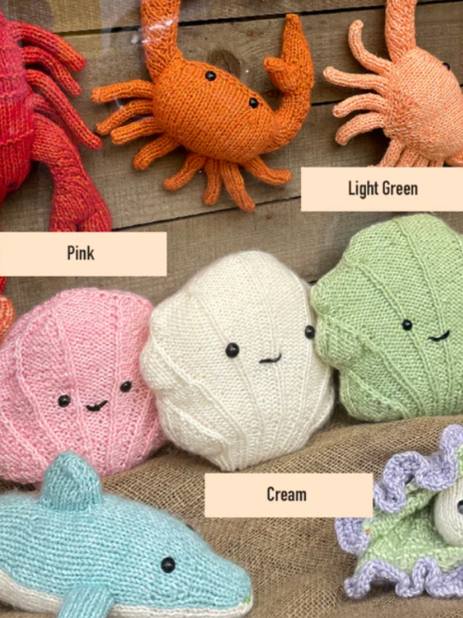 Shell Knit Kit. Three shells in pink, cream, and light green.
