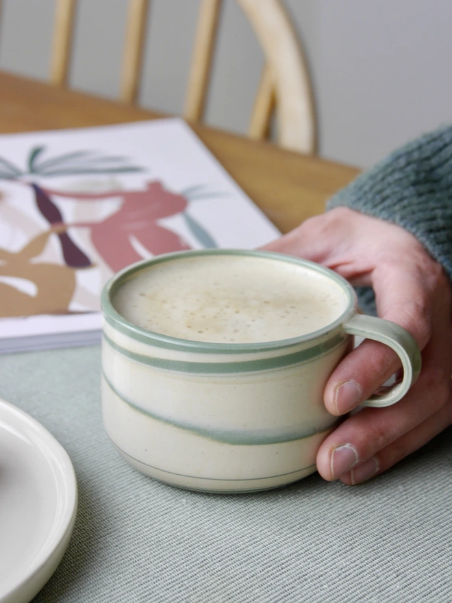Small handmade green and white marble mug