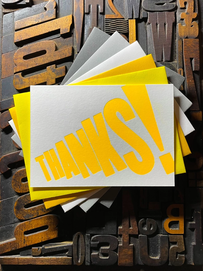 Thanks! A vibrant thank you typographic letterpress card with deep impression print using fluorescent yellow, with a range of colourful envelopes. Slight print variations adding to the style anding to the charm of this handmade greeting card.