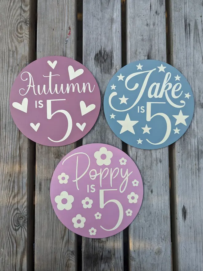 personalised wooden birthday sign. three round wooden signs with personalised birthday messages.