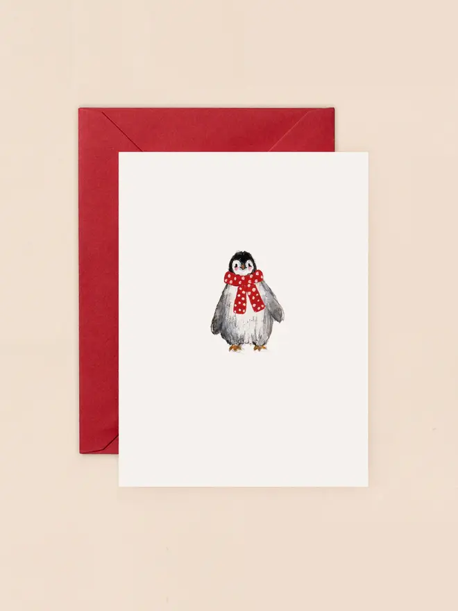 illustrated penguin with red scarf christmas card