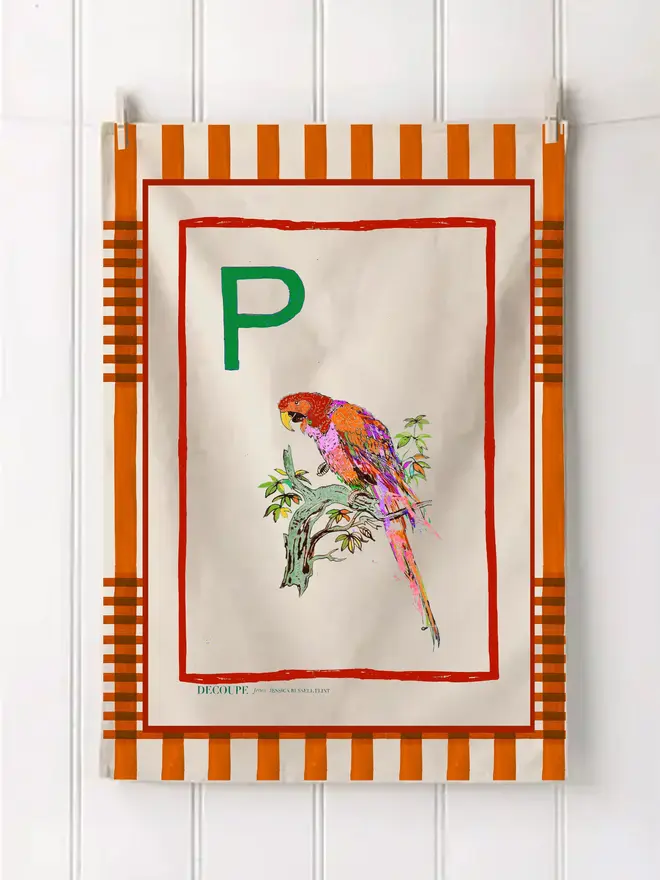 a-z alphabet tea towel. a tea towel with a parrot print and the letter 'p' in the corner.